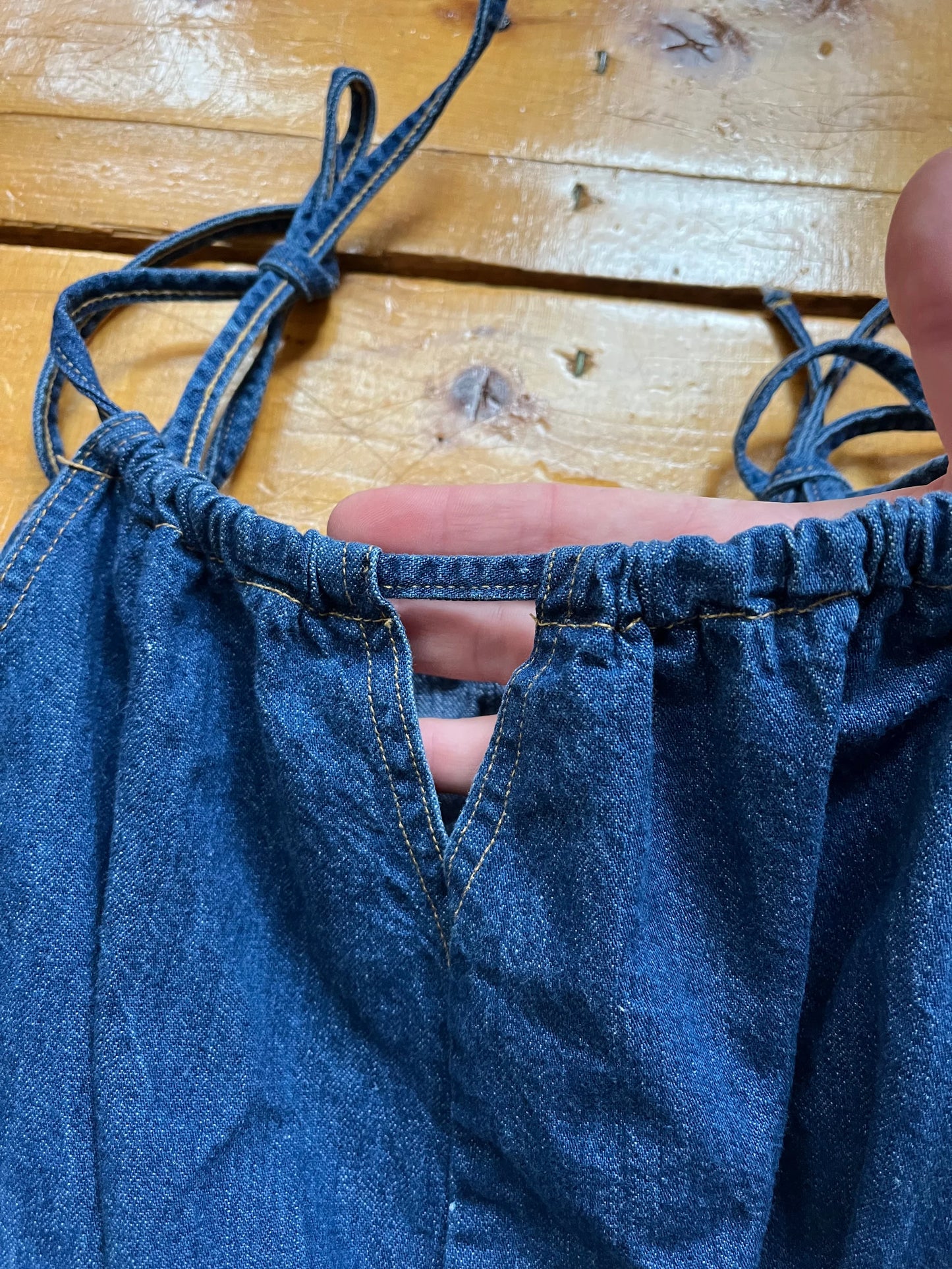 70’s Denim Romper1970’s Jeanistics denim romper with stretch waist and tie straps. Fits like a small.