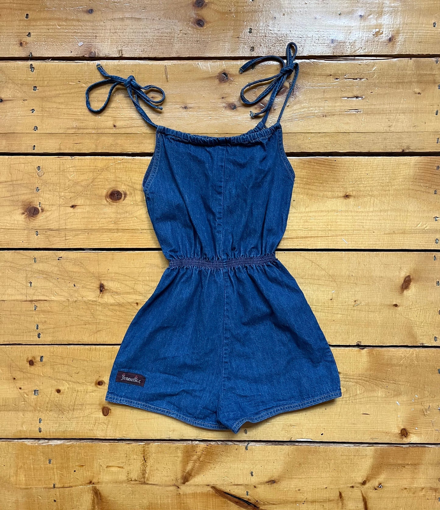 70’s Denim Romper1970’s Jeanistics denim romper with stretch waist and tie straps.  Fits like a small.